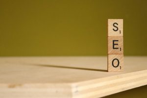 scrabble tiles stacked on top of each other to spell SEO