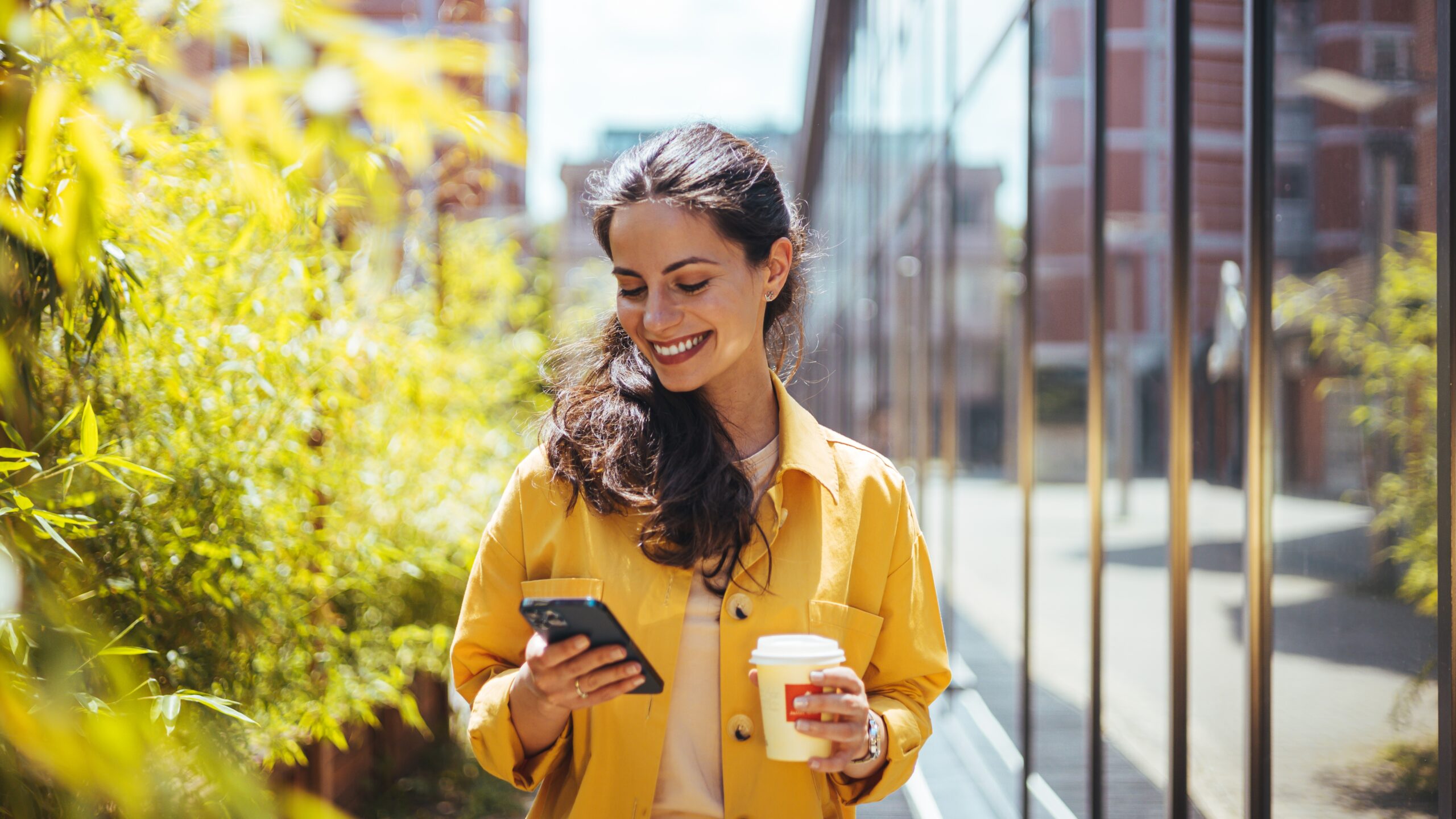 woman checking her phone, online ad viewership, online ad attribution, campaign measurement, reach real people with your online ads, attribution