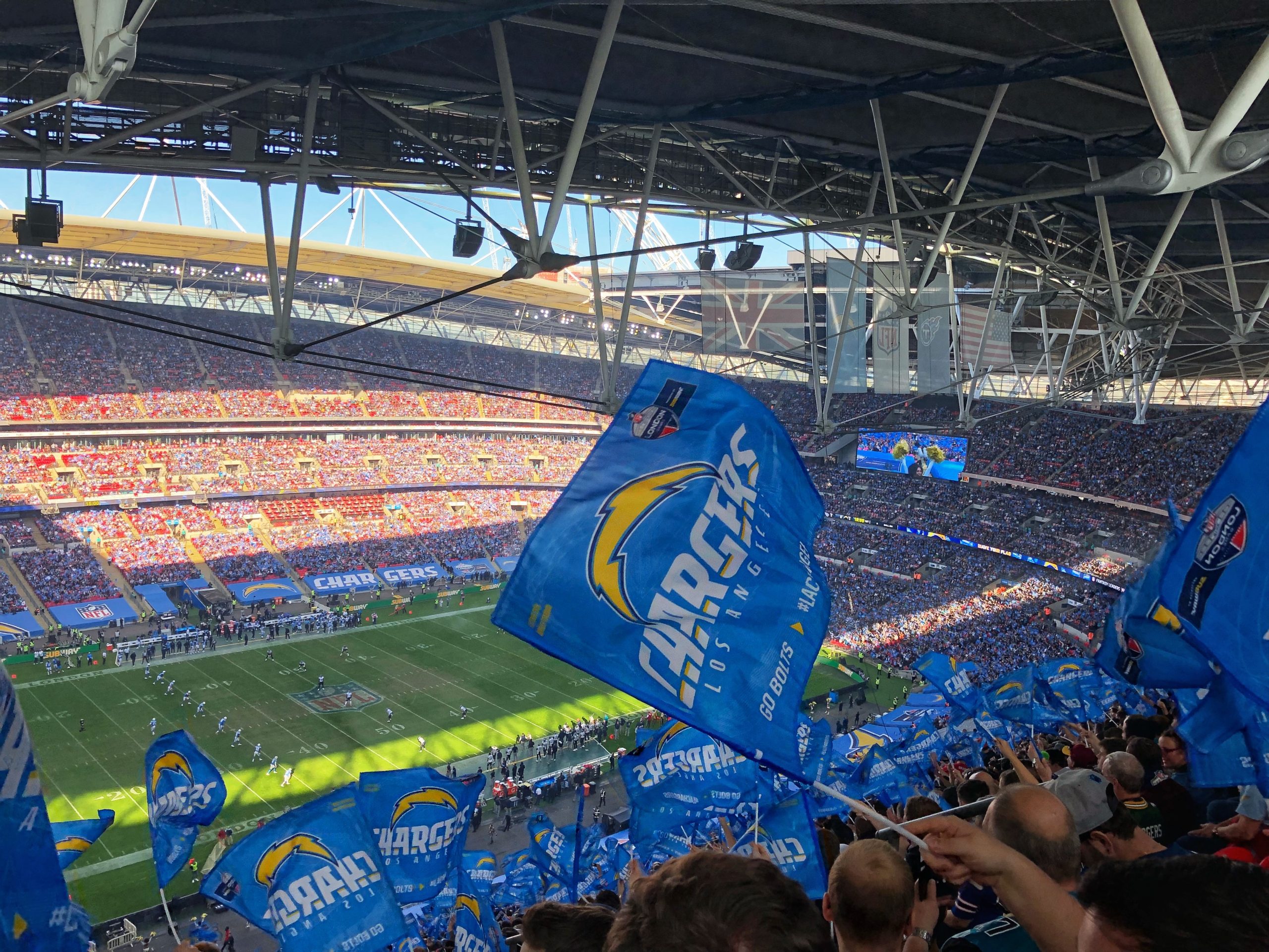 image of nfl game with chargers flags flying